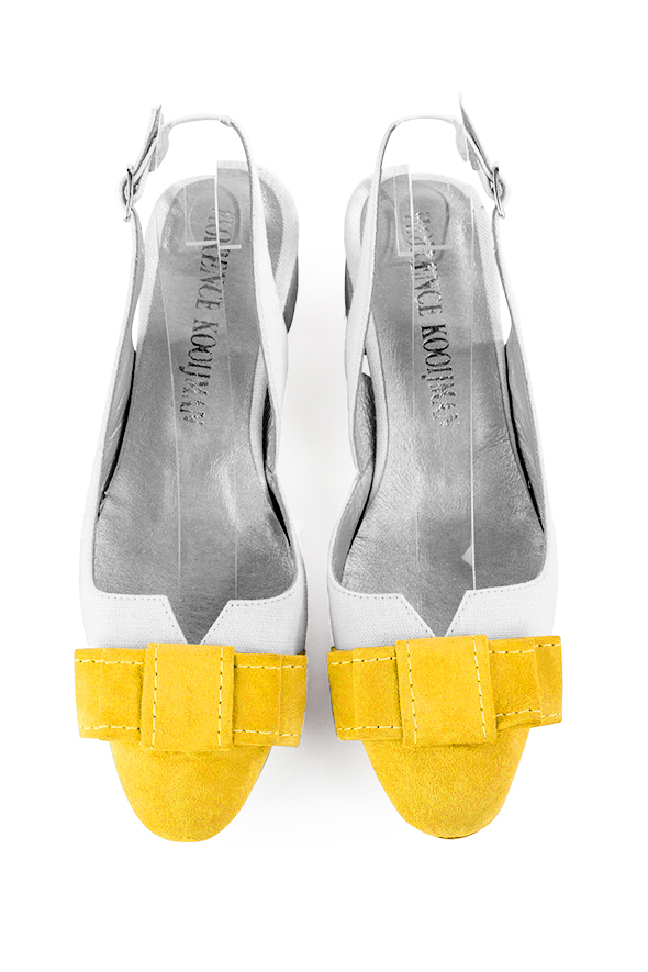 French elegance and refinement for these yellow and pure white dress slingback shoes, with a knot, 
                available in many subtle leather and colour combinations. The pretty French spirit of this beautiful pump will accompany your steps nicely and comfortably.
To be personalized or not, with your materials and colors.  
                Matching clutches for parties, ceremonies and weddings.   
                You can customize these shoes to perfectly match your tastes or needs, and have a unique model.  
                Choice of leathers, colours, knots and heels. 
                Wide range of materials and shades carefully chosen.  
                Rich collection of flat, low, mid and high heels.  
                Small and large shoe sizes - Florence KOOIJMAN
